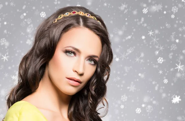 Beautiful young brunette in golden coronet Stock Image