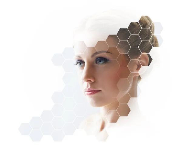 Face of young woman in honeycombs — Stock Photo, Image