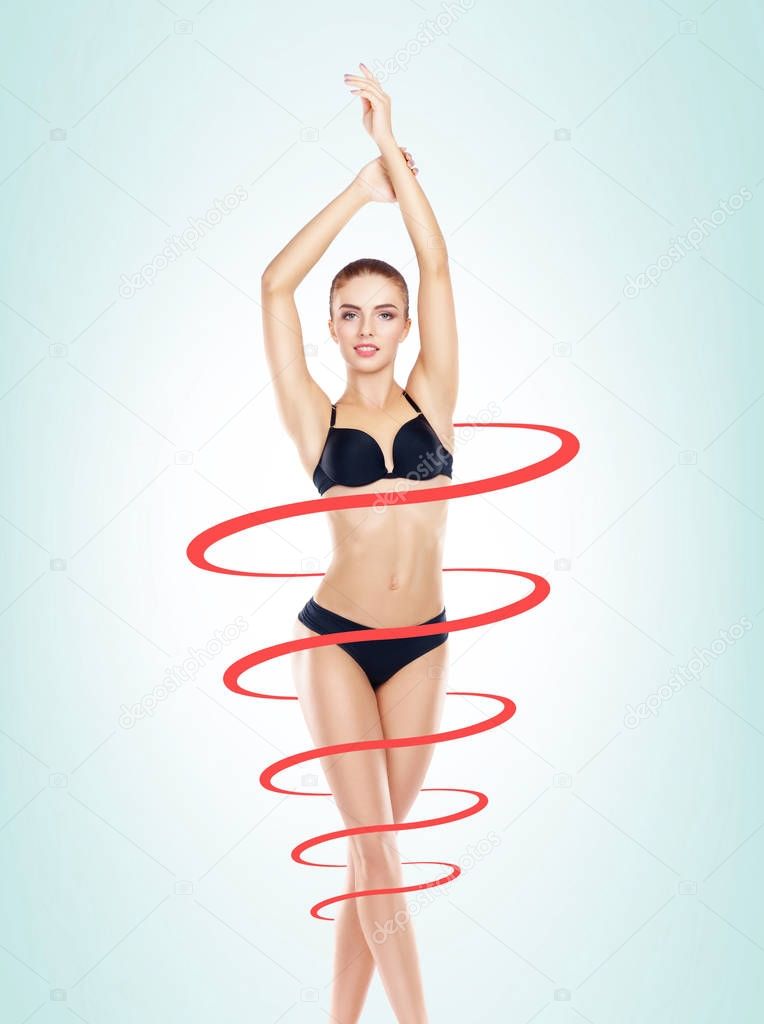 spiral around slim and beautiful body of young woman in lingerie. Weight loss, sports, exercising, water balance, healthy nutrition concept