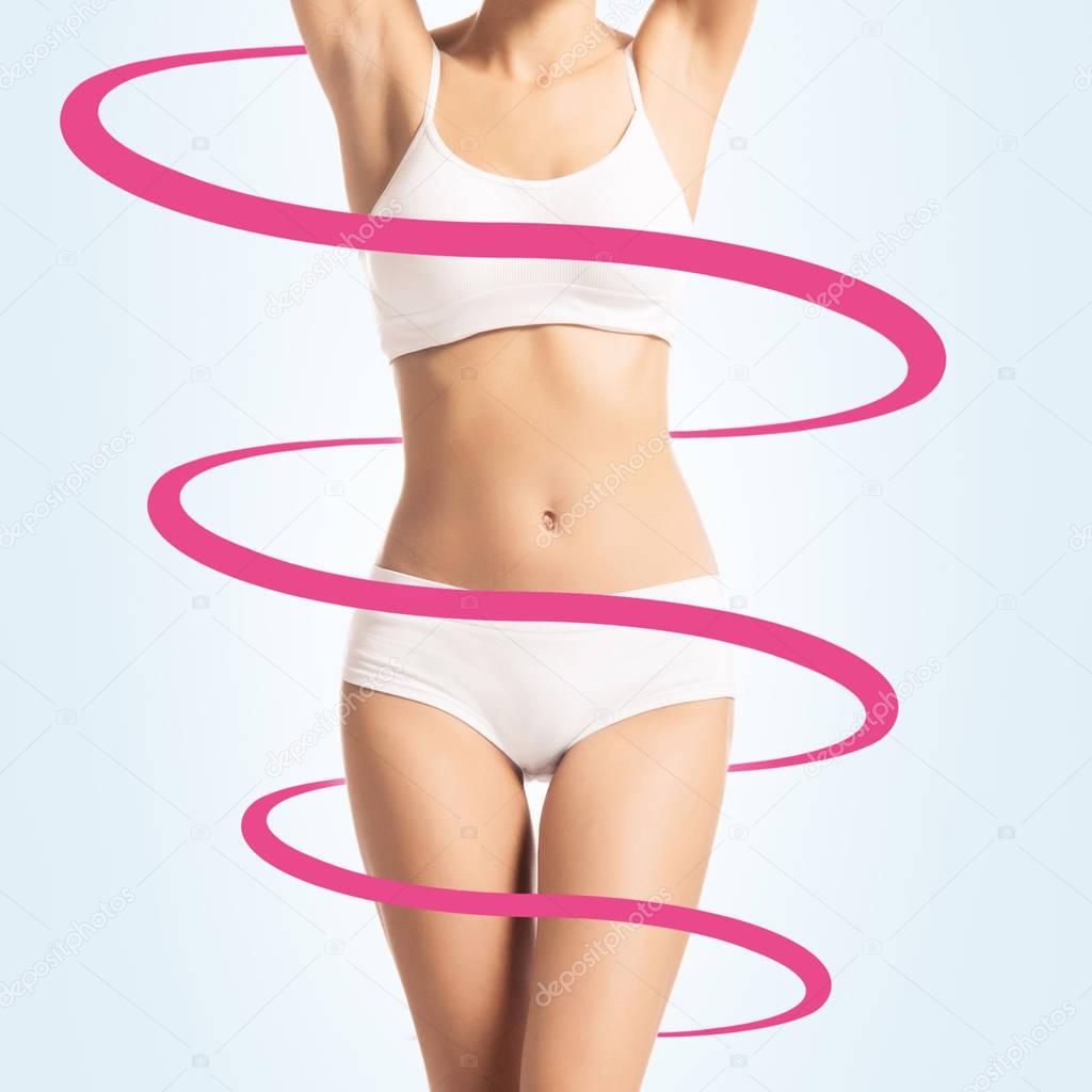 spiral around slim and beautiful body of young woman in lingerie. Weight loss, sports, exercising, water balance, healthy nutrition concept