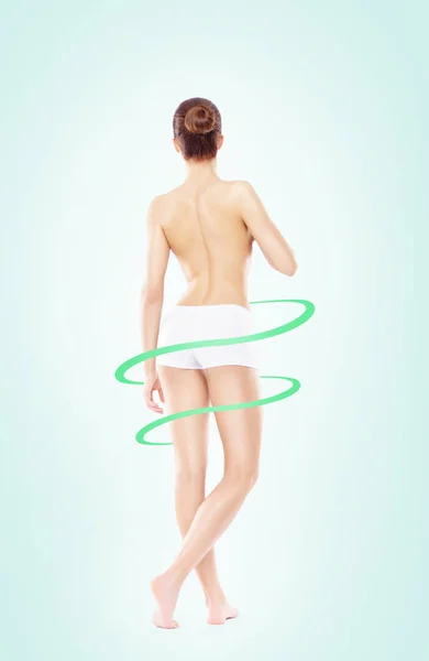 Close-up of thin and beautiful female body. Back and buttocks. Weight loss, sports, exercising, water balance, healthy nutrition concept. Blue arrows.