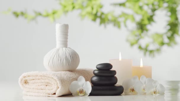 Oriental Massage Treatment Composition Towel Candles Flowers Stones Herbal Balls — Stock Video