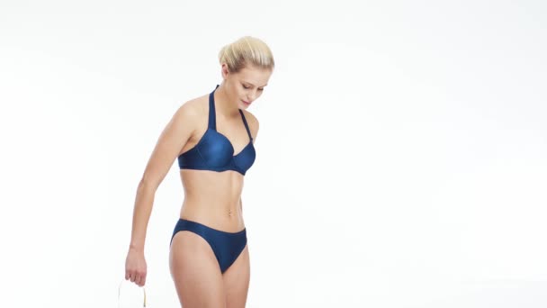 Young Beautiful Fit Natural Blond Woman Blue Swimsuit Measuring Her — Stock Video
