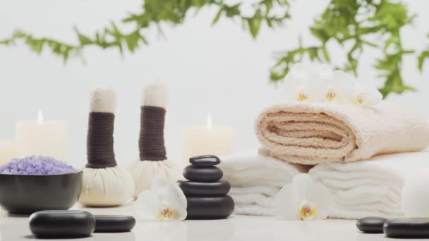 Spa Background Composition Towel Candles Flowers Stones Herbal Balls Massage — Stock Video