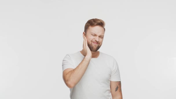 Expressive Young Man Having Pain Vibrant Background Studio Portrait Handsome — Stock Video