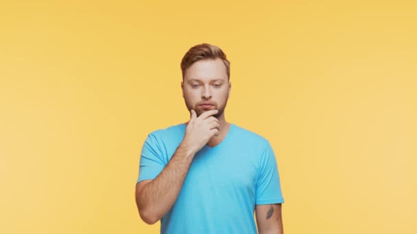 Thinking Young Man Vibrant Background Studio Portrait Expressive Handsome Person — Stock Video