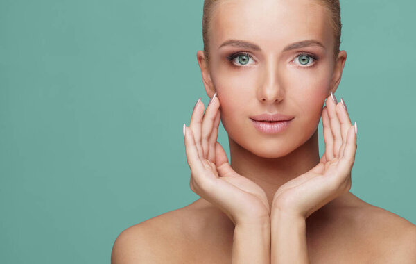 Beautiful face of young and healthy woman. Skin care, cosmetics, makeup, complexion and face lifting concept.