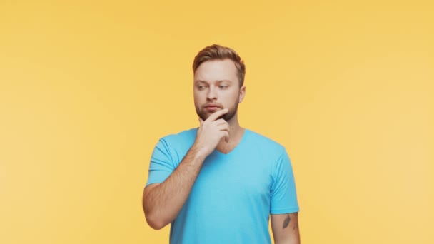 Thinking Young Man Vibrant Background Studio Portrait Expressive Handsome Person — Stock Video