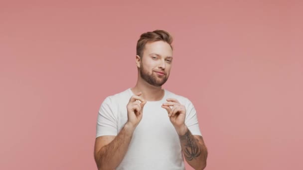 Expressive Young Man Vibrant Background Studio Portrait Handsome Person Pointing — 비디오