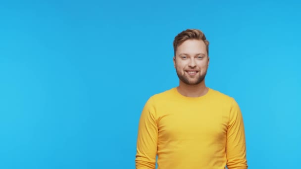 Expressive Young Man Vibrant Background Studio Portrait Handsome Person Pointing — Stock Video