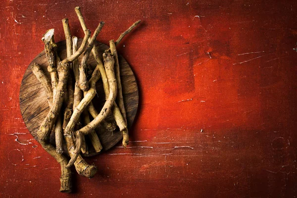 Horseradish root on red vintage background — Stock Photo, Image