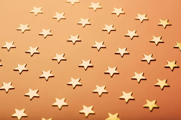 Pinky holiday background with golden stars — Stock Photo, Image