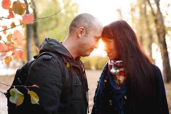 Loving couple in the autumn park together — Stock Photo, Image