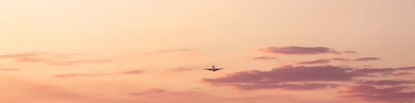 Sunset sky with taking off plane — Stock Photo, Image