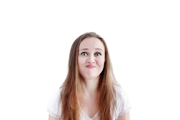 Confused young caucasian woman with disgusted facial expression and grimacing — Stock Photo, Image