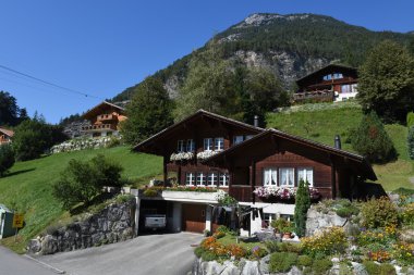 Rural chalets at Wilen on the Swiss alps clipart