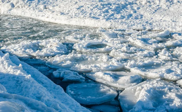 Melting circular ice floes floating in channel. — Stock Photo, Image