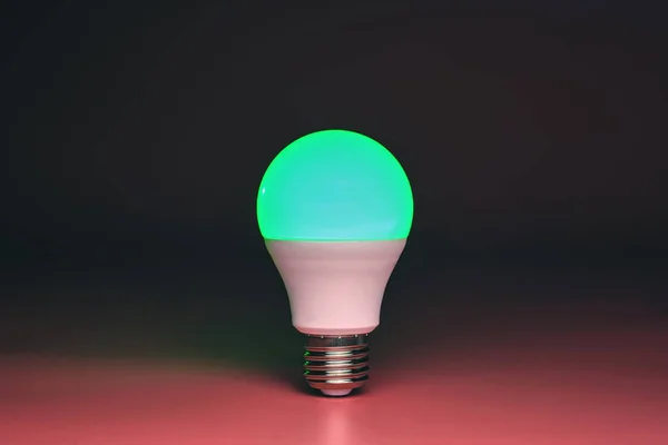 Green light bulb, modern energy saving, copy space. Minimal idea concept. — Zdjęcie stockowe