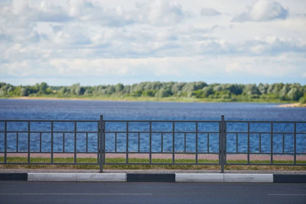 Fencing on the river embankment. Iron railing to protect and support people on walk. — Stock Photo, Image
