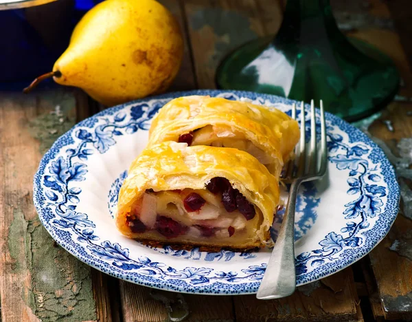 Pear and cranberry strudel .selective focus. — Stock Photo, Image