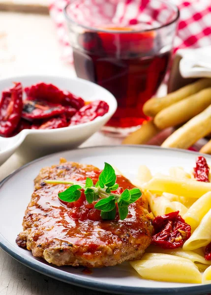 Pork Cutlets in Pizzaiola Sauce. Stock Photo