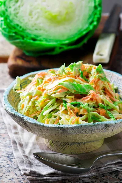 Cabbage salad cole slaw in a ceramic bowl