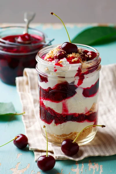 Cherry cheesecake in a  jar.style rustic — Stock Photo, Image