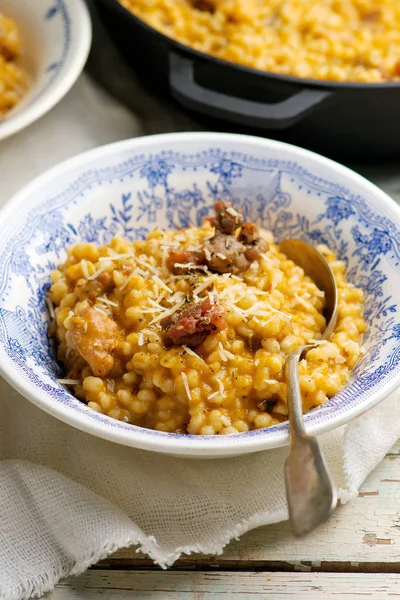 CREAMY PUMPKIN BARLEY With SAUSAGE — стоковое фото