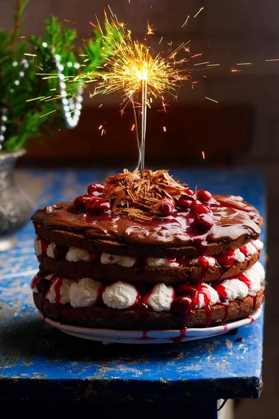 Chocolate cherry cake Bengal light — Stock Photo, Image