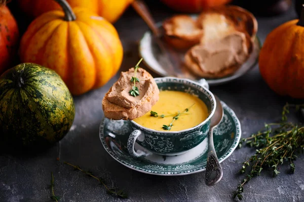 Pumpkin soup with liver pate toast.style rustic — Stock Photo, Image