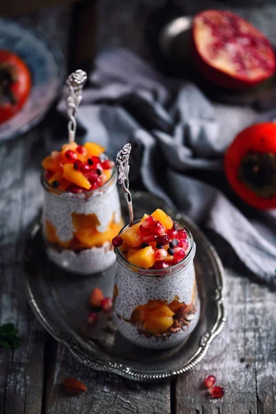 Chia pudding with persimmon and pomegranate. — Stock Photo, Image