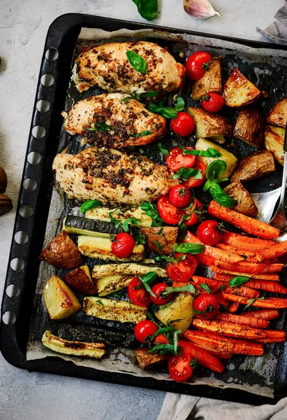 Sheet pan chicken and veggies..style rustic.selective focus