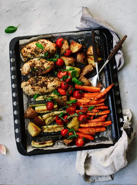 Sheet pan chicken and veggies..style rustic.selective focus