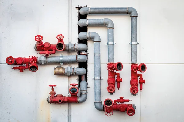 Water pipes with red valves — Stock Photo, Image