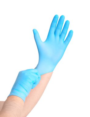 Mavi steril eldivenli eller beyaz çayırlarda izole edilmiş..