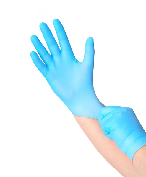 带蓝色无菌手套的手隔离在白色的浴场上 — 图库照片