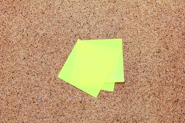 Yellow sticky notes on a cork board — Stock Photo, Image