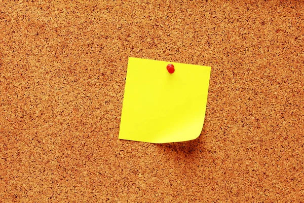 Yellow sticky notes on a cork board — Stock Photo, Image