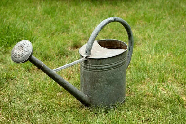 Old metal watering can Royalty Free Stock Images