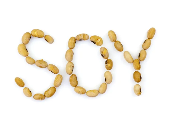 Palavra SOY escrito sementes de soja — Fotografia de Stock