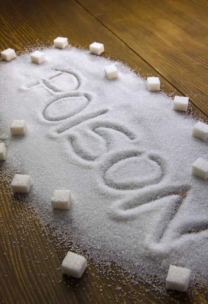 ENvenenamiento escrito en una pila de azúcar — Foto de Stock