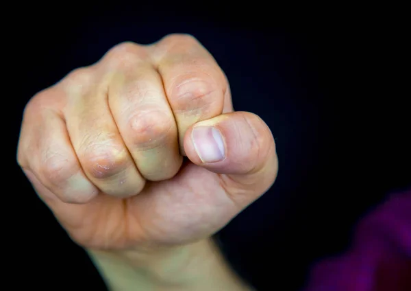 Menselijke vuisten - geweld concept — Stockfoto