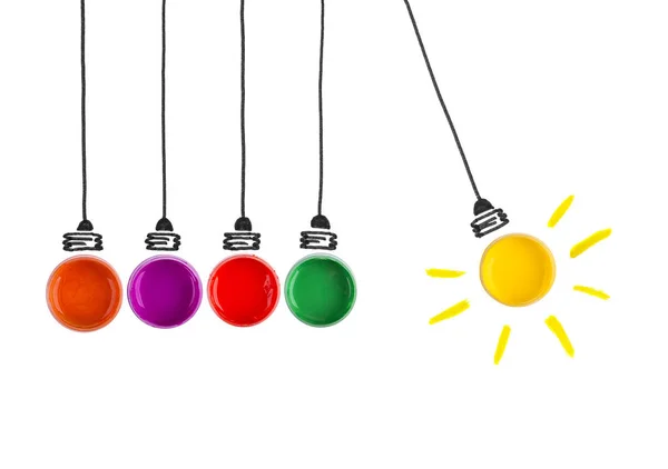 Hanging light bulbs of paint and light yellow paint with one oth — Stock Photo, Image