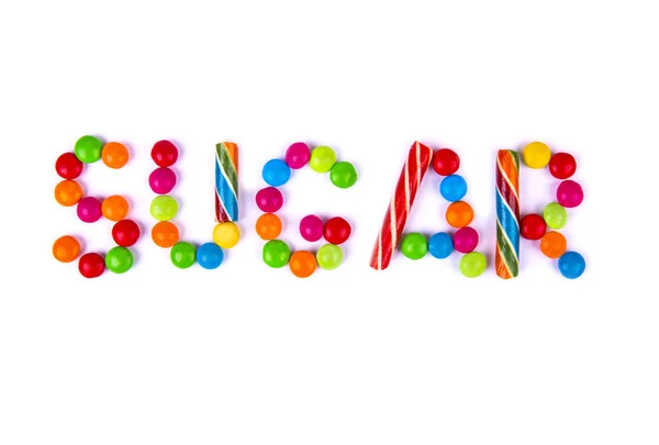 The word sugar is written in candy — Stock Photo, Image