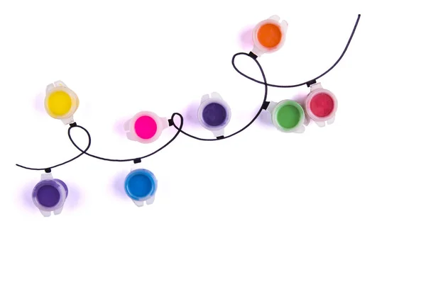 Colorful garland of paints on a white background — Stock Photo, Image