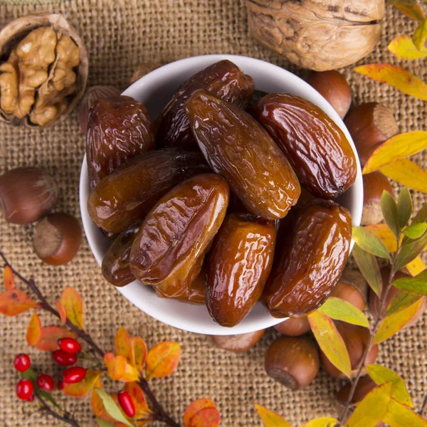 Dates and nuts. Autumn concept. — Stock Photo, Image