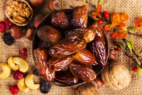 Dates and nuts. Autumn concept. — Stock Photo, Image