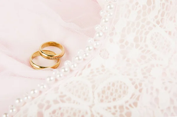 Beautiful wedding rings on pink — Stock Photo, Image