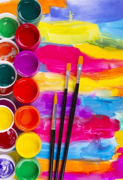 Paints palette and paint brushes — Stock Photo, Image