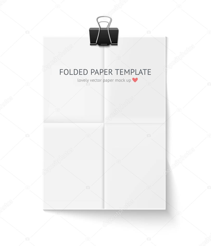 White sheet of paper folded in four hangs with clip isolated